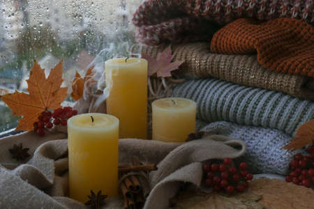 Blown candle with smoke Hello Fall, celebrating autumn holidays at cozy home on the windowsill Hygge...