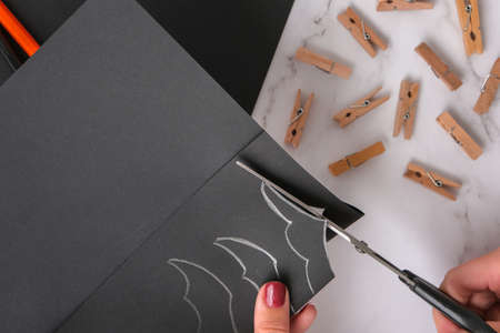 paper bats. Halloween holiday decorations. Flat lay, top view Happy Halloween party concept....