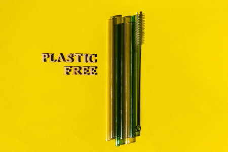Reusable glass Straws on yellow background with text Plastic FREE Eco-Friendly Drinking Straw Set...