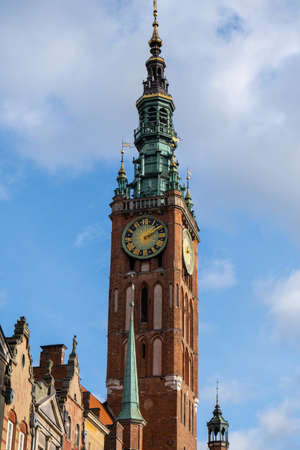 City hall medieval Gothic Saint Mary Cathedral Main City Hall at Dlugi Targ Square Ancient architecture of old town in Gdansk Poland. Beautiful and colorful old houses historical part of downtownの写真素材