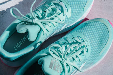Kiev Ukraine - October 2021 Adidas swift run shoes for running for woman - illustrative editorial Blue and pink trendy Adidas Running boots. multinational company. Unisex for women and menのeditorial素材