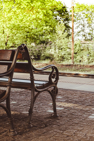 Railway station with empty bench. The way forward railway for train. Empty railway track for...