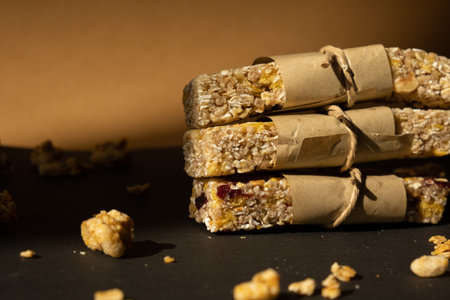 Homemade natural Granola energy bar. Variety of homemade Protein granola breakfast bars with nuts, raisins dried cherries and chocolate. Healthy nutrition food. Gluten free cereal dieting snack super food Sport oatmeal bar Vegan dessert conceptの写真素材