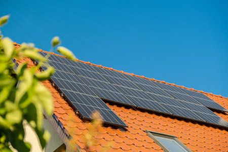 New ecologic house with solar panels Alternative to conventional energy. The battery is charged from a solar cell Advertisement Green energy Sustainable life Renewableの写真素材