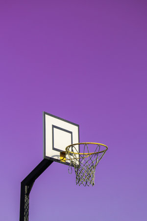 Street basketball hoop on background of vibrant sky. Creative minimalistic photo. Street Basketball Loop Basket Outdoors Abstract sport wide blank empty background texture, copy space. Sports, leisure activities creative bright backgrounds conceptの写真素材