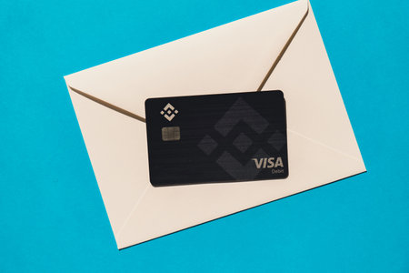 Gdansk Poland - 20 June 2022: Black Binance Coin Card. Visa debit card BNB, Binance Exchange...