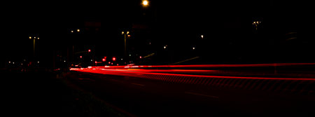 Lights of cars at night. Street line lights. Night highway city. Long exposure photograph night...