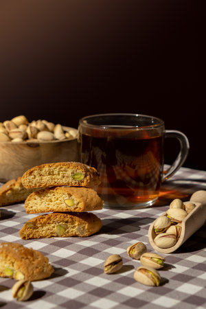 Biscotti Cantuccini Cookie Biscuits with pistachios and lemon peel Shortbread. Cup of tea. Teatime break Healthy eating food. Homemade fresh Italian cookies cantucci stacks and organic pistachios nuts. Vegan dieting vegetarian. Nutritionの写真素材