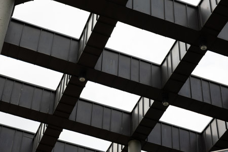 Modern office building exterior with glass facade on clear sky background. Transparent glass wall of office building with yellow decoration. Abstract Structure Element of facade of modern European building Commercial office buildings. modern business architecture Architecture minimal concept. Visual art. Conceptual photographyの写真素材