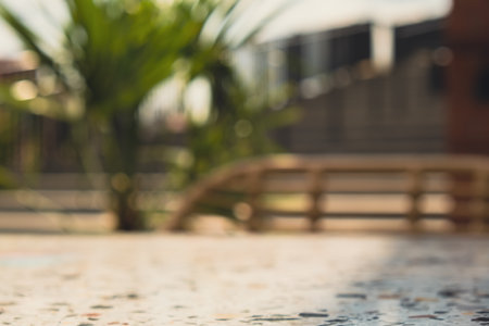 Defocused Empty abstract blurred restaurant background. Blurry cafe terrace on day time with palm trees or coffee shop chairs. Food and drink concept.の写真素材