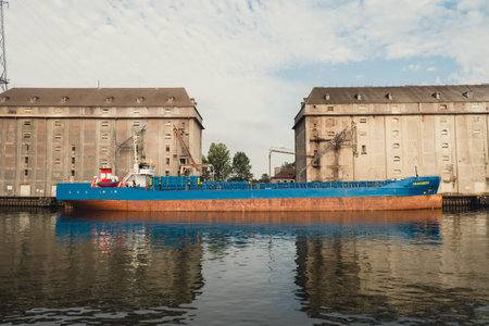 Gdansk, Poland - May 2022 Touristic travel ferry ship goes through Motlawa river to Baltic Sea. POV from ferry swimming on river canal. Ferry boat sailing from downtown old town Gdansk. Cruise liners and ships around. Tourist attractionのeditorial素材