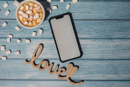 Close up of Cup hot chocolate marshmallows cacao Wooden decoration LOVE text. Cozy Coffee with...