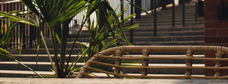 Defocused Empty abstract blurred restaurant background. Blurry cafe terrace on day time with palm trees or coffee shop chairsの写真素材
