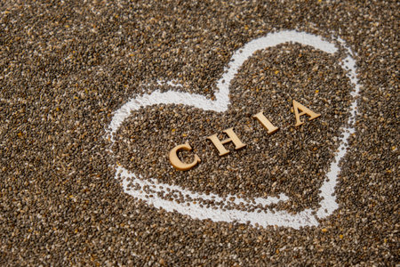 Heart made of chia seeds with word CHIA inside background. Healthy superfood rich in Omega 3 fatty acids. Dry healthy natural ingredient. Vegetarian food favorite dietaryの写真素材