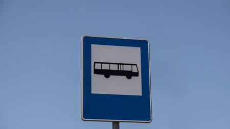 Blue and white bus stop sign in Europe with sky background. Bus stop old road signの写真素材