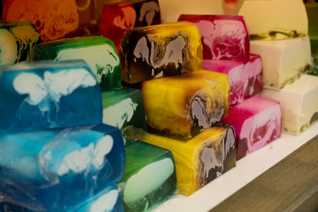 Handmade aromatic soap. Selective focus. Soaps and cosmetics on street market festival. Craft soap...