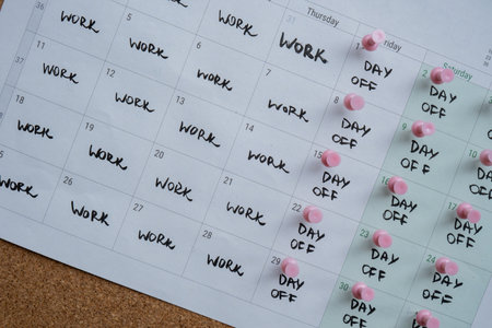 4 day work week printed calendar with pink pins on three days off in week weekend days four day working week concept. Modern approach doing business short workweek. Effectiveness of employees. Productivity and efficiencyの写真素材