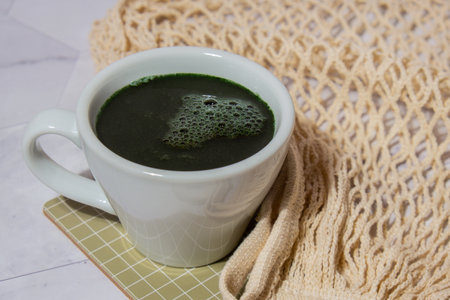 Matcha coffee latte Blue-green algae Chlorella and spirulina powder drink. Super powder. Natural supplement of algae. Detox superfood drink cocktail. Food supplement source of protein and beta caroteneの写真素材