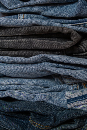 Abstract Stack of jeans. Background fashion jeans texture Various Shades Denim. Canvas denim...