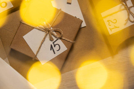 Original Advent Calendar for Christmas Homemade. Preparation to Christmas concept. Family winter holidays. Eco friendly presents gifts. open the package every dayの写真素材