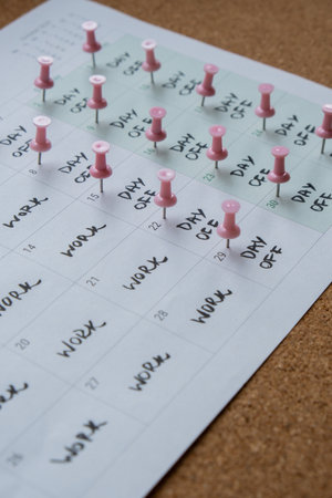 4 day work week printed calendar with pink pins on three days off in week weekend days four day working week concept. Modern approach doing business short workweek. Effectiveness of employees. Productivity and efficiencyの写真素材