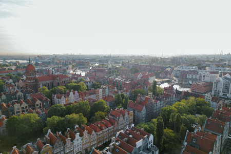 Beautiful panoramic architecture of old town in Gdansk, Poland at sunrise. Aerial view drone pov....