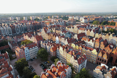 Beautiful panoramic architecture of old town in Gdansk, Poland at sunrise. Aerial view drone pov. Landscape cityscape City from Above. Small vintage historical buildings Europe Tourist Attractions travel destinationの写真素材