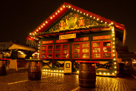Gdansk Poland - December 2022 Traditional Christmas Market Holiday Decorated and illuminated street at night. Closed Trading Houses With Sale Of Christmas Gifts Beautiful Christmas fair in the old town at night. Advent winter time in Europe backgroundのeditorial素材