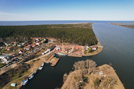 Yacht marina in harbour Sobieszewo Island. Aerial Drone view of the green district of Gdansk located on the Vistula Riverの写真素材