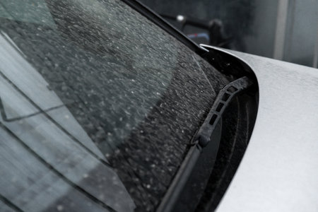 Details of dirty car before washing luxury silver car on touchless car wash. Cleaning the details of car. Cleanliness environmentの写真素材