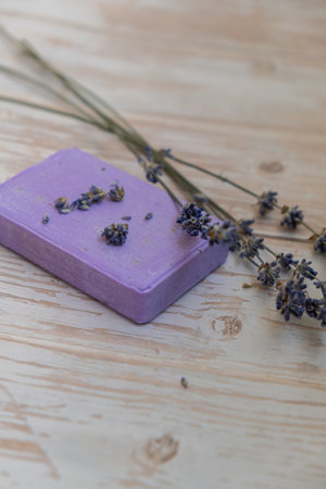 Handcrafted purple lavender soap with lavender flowers. Natural hydrating moisturiser softness cosmetic. Organic calming beauty skincare product. Herbal self care wellness alternative soapの写真素材