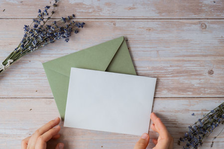 Empty white envelope paper card note template mock up. Copy space for your text. Lavender flower....