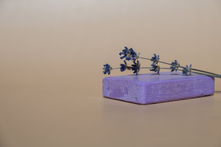 Handmade aromatic spa lavender soap. Natural additives and extracts. Bar of lavender soap with dried flowers. Beauty treatment product herbal ecological organic cosmeticsの写真素材