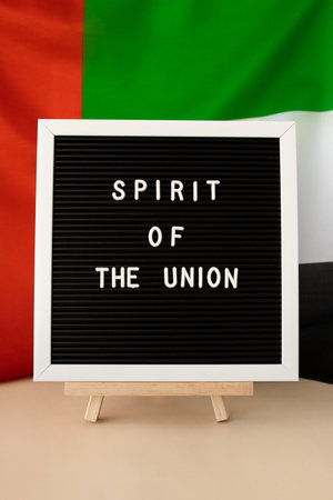 SPIRIT OF THE UNION text frame on United Arab Emirates waving flag made from silk material....