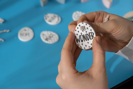 Master class word WONDER on EASTER clay egg Creator is using white air dry clay for making decor to...