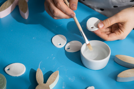 Creator is using white air dry clay for making decor to EASTER holiday. Creating hobby recreation...