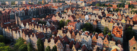 Beautiful panoramic architecture of old town in Gdansk, Poland at sunrise. Aerial view drone pov....