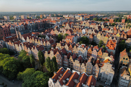 Beautiful panoramic architecture of old town in Gdansk, Poland at sunrise. Aerial view drone pov....