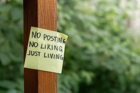NO POSTING NO LIKING JUST LIVING text on paper note on background of greenery garden. Concept of...