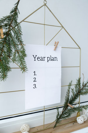 Vision board with YEAR PLAN new year resolutions aims goals on paper note. Preparation for New Year....