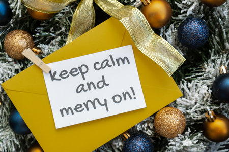 Greeting card with KEEP CALM AND MERRY ON text on handmade Christmas wreath. Festive mood new year...