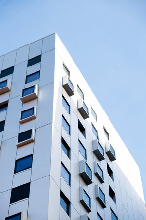 Modern office building exterior with window glass facade on clear sky background. Office building....