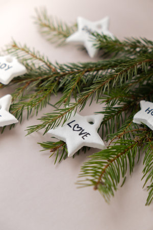 Christmas star with word LOVE Group of air dry clay handmade Christmas decor on beige background. Children air dry clay activity handicraft idea. Preparing for Christmas holiday decorating. Modern organic design minimalistic plastic free sustainableの写真素材