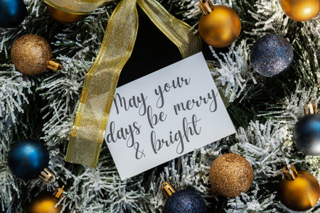MAY YOUR DAYS BE MERRY AND BRIGHT text on postcard on handmade Christmas wreath. Zero waste eco-friendly Christmas. Sustainable greeting cardの写真素材