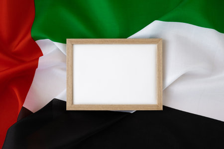 Empty white paper frame Small flag of UAE on beige background with colorful envelopes. Copy space. Mock up advertisement template. Tourism travel voucher with United Arab Emirates national symbol. Visit Dubaiの写真素材