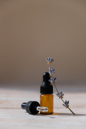 Lavender flowers with dropper glass bottle of essential oil. Concept of alternative medicine. Herbal natural detox treatment. Stress relief calming mental health productsの写真素材