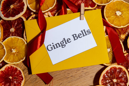 Christmas handmade wreath made of dried slices of orange and grapefruit with yellow envelope and...