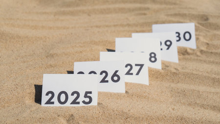 Paper cards with numbers of years from 2024 to 2030 in a row. New year start concept. Resolution...