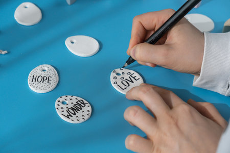 Master class writing word LOVE on EASTER egg Children air dry clay activity handicraft idea. DIY process step by step instruction. Preparing for Easter holiday decorating. Modern organic design minimalistic plastic free sustainableの写真素材