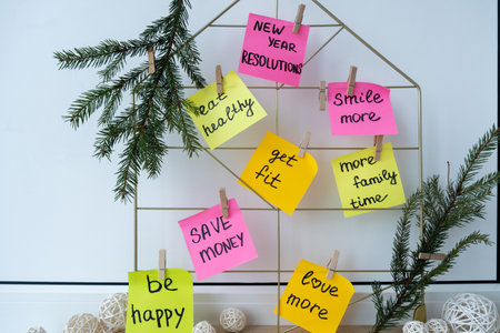 Vision board with new year resolutions aims goals on sticky notes. Preparation for New Year. Planning and setting goals for personal developmentの写真素材